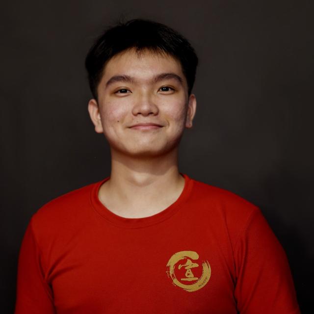 Coach Kun Xuan, a homegrown athlete turned dedicated coach, brings deep understanding and enthusiasm to every training session. Known for his patience and passion, he enjoys guiding the next generation of athletes to become champions, just as he once was. His friendly nature and genuine care make him a favorite among his students.