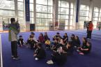 Coach Shang Yu briefing the athletes