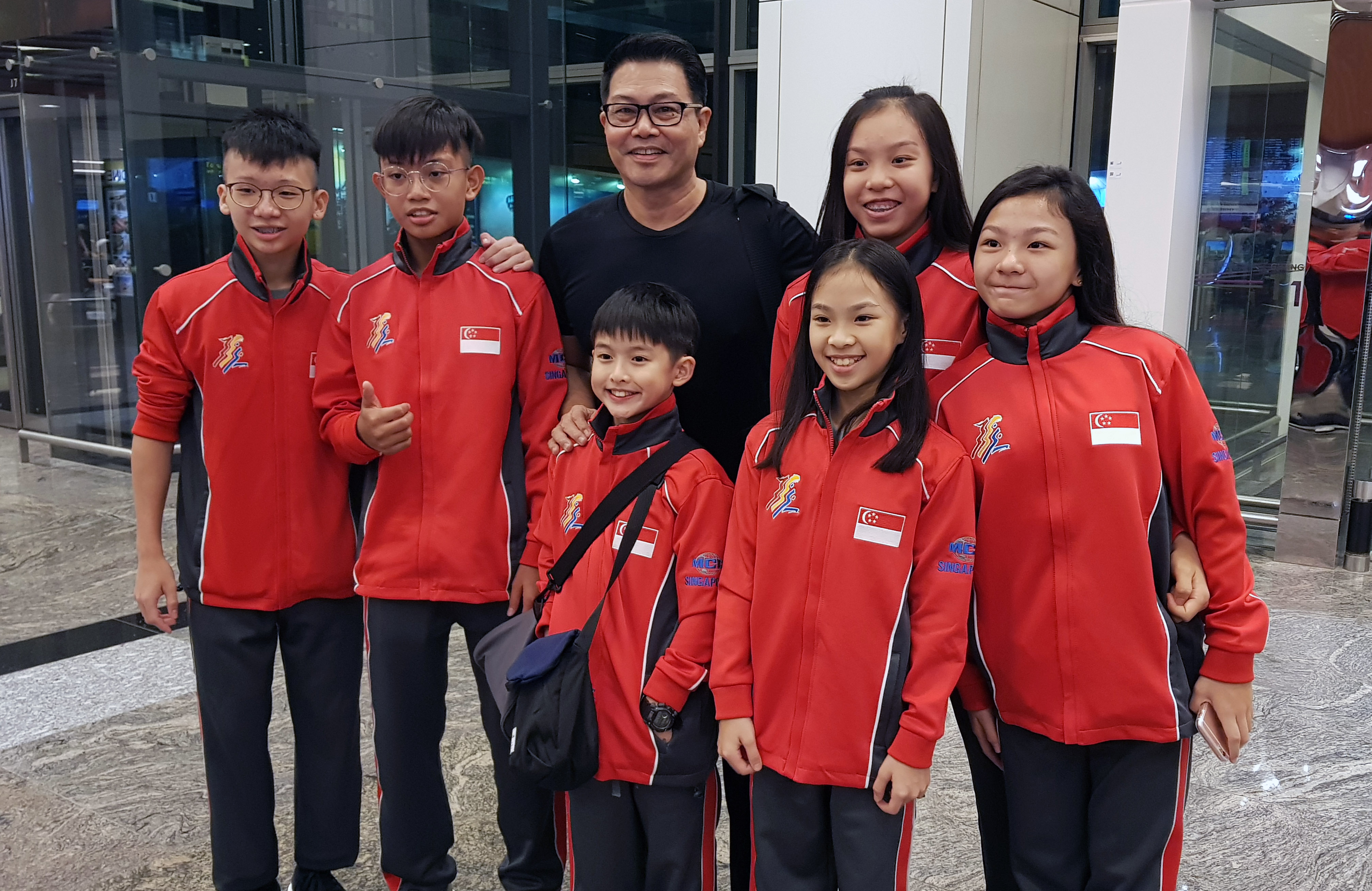 Xuan Sports athletes with Coach Winston Xuan Sports athletes with Coach Winston