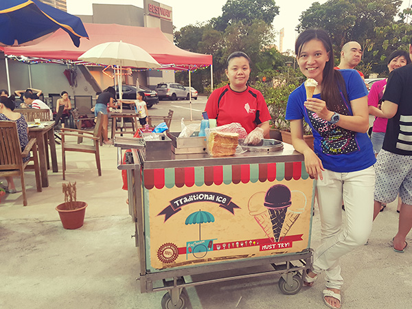 Coach Wen Xin with the traditional ice-cream cart Coach Wen Xin with the traditional ice-cream cart