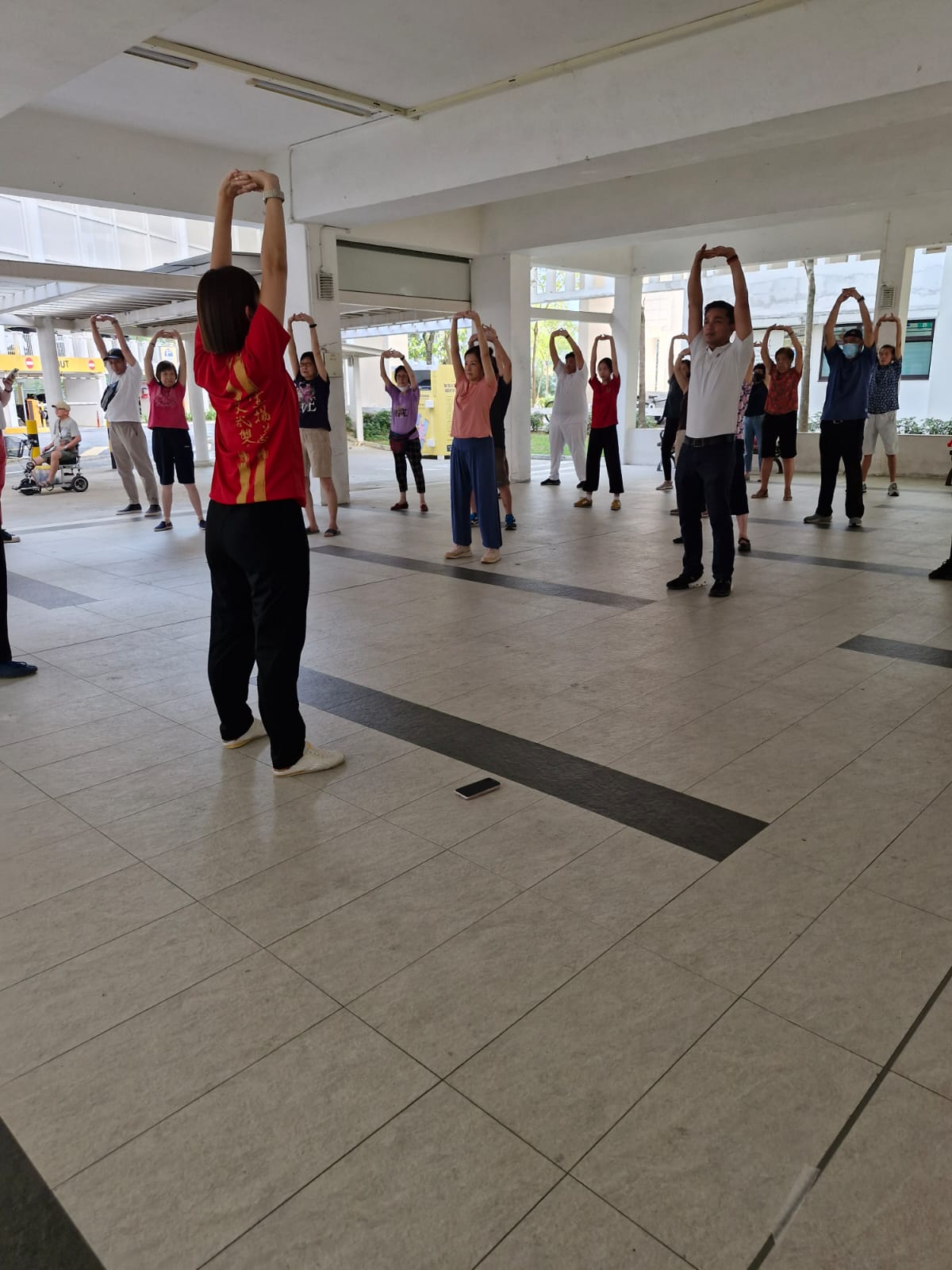 Coach Jennee showing the participants some stretching exercises Coach Jennee showing the participants some stretching exercises