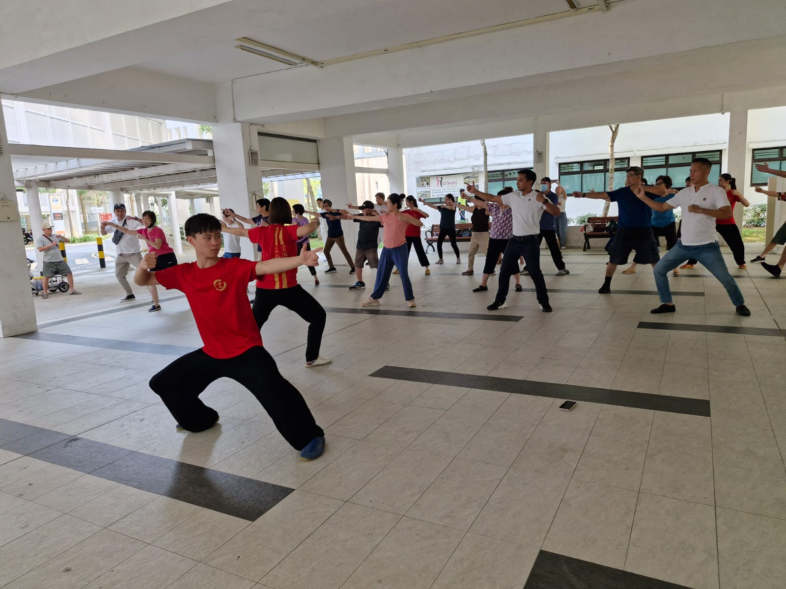 Xuan athlete, Ian Chua, leading the Taiji exercises