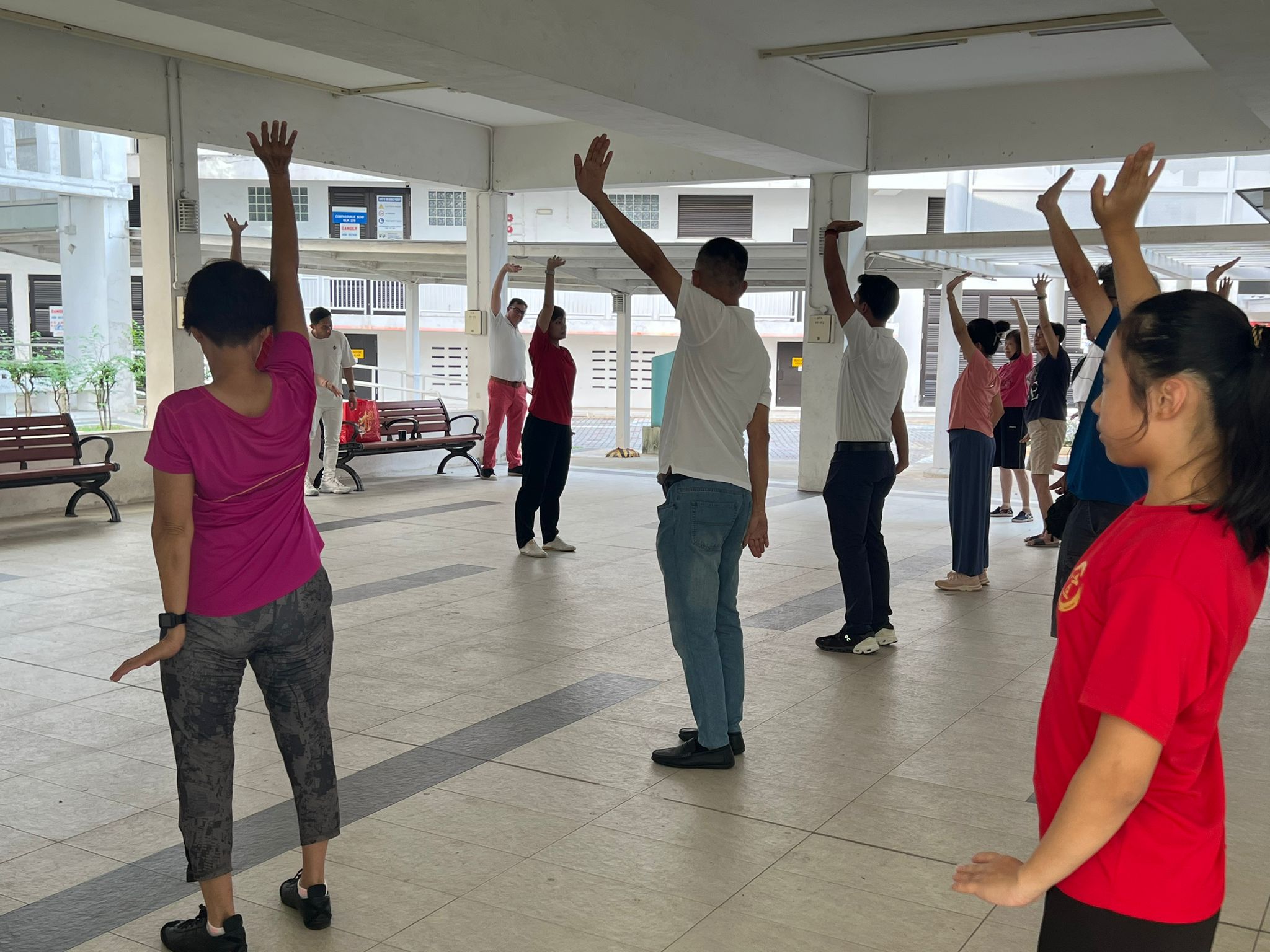 Xuan Taiji athlete, Cholene Aw, leading the exercises amongst the participants